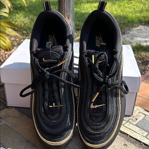 Nike Black Sneakers with Gold Highlights